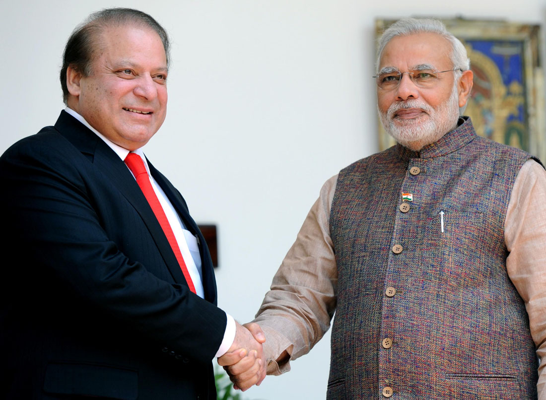 Prime Minister Narendra Modi (R) shakes hands with his Pakistani counterpart Nawaz Sharif (L) during a meeting at Hyderabad House in New Delhi on May 27, 2014. (Photo: IANS)